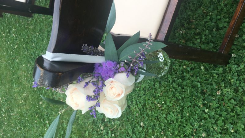 DIY flowers on wedding chairs in the garden at Mitchell Grove in Humboldt County