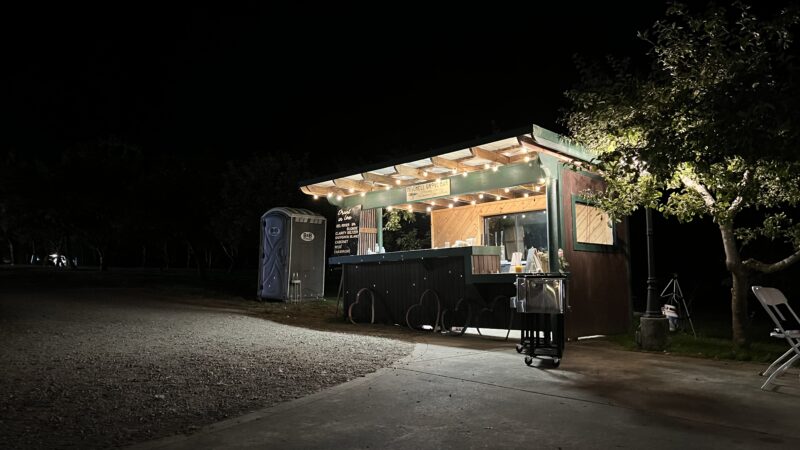 Outdoor bar at Mitchell Grove wedding venue with four taps for guest use.