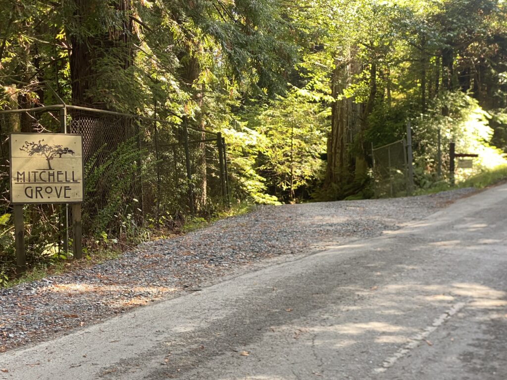 Mitchell Grove wedding venue sign at the road entrance with directions—if you get to the gold rock, you’ve gone too far.
