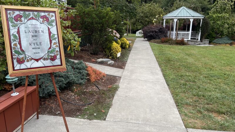 Stained glass wedding sign handmade by the bride’s friend at Mitchell Grove