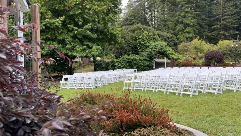 Simple wedding setup at Mitchell Grove with orchard, redwoods, gazebo, and garden chairs