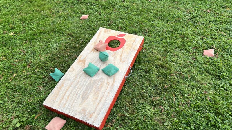 Cornhole game kept at Mitchell Grove, originally made by a bride and now part of the lending closet collection.