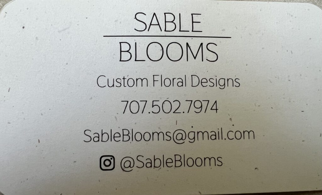 Business card for Sable Blooms Custom Floral Designs, local florist who arranged family-grown wedding flowers for a Mitchell Grove wedding.